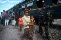 Second UN HCR train repatriating people from Khmer Rouge sites.  Woman holding a child in the foreground.