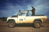 Dutch made UN jeep with a soldier standing behind a mounted rifle in the back.