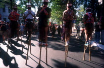 Line of stilt walkers at the 25th Anniversary Parade for the liberation of Saigon.