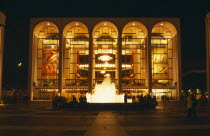 The Lincoln Center for the Performing Arts exterior and fountain at night.
