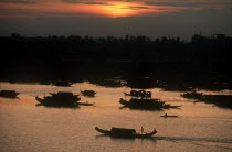 Boats on the Perfume River at sunset.
