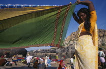 Woman drying sari