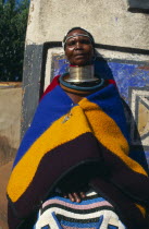 Near Middleburg  local woman in traditional dress inc. large necklace.