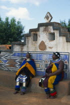 Botshabelo Ndebele Village  formerly Missionary Station  two local women in traditional dress sitting down.