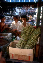 Woman selling Marajuana drugs in market by the docks area