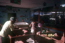 Sparse fruit shop with customers