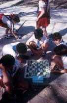 Schoolkids playing chess