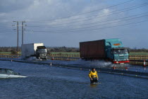 Chichester by-pass with traffic driving through flood water