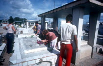 People visiting the graveyard on Fathers Day