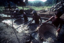 Men panning for gems in a gem mine