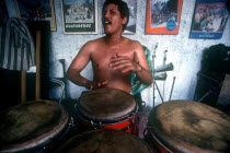 Musician playing Bongo Drums
