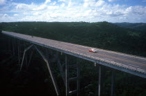 View over bridge with one or two cars crossing