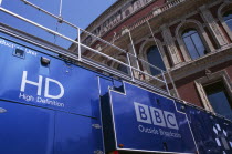 Kensington. The Royal Albert Hall. Part view of the exterior with a blue BBC Outside Broadcast truck in front.