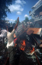 Anti Khmer Rouge and Samphon demonstration.  Protestors burning debris.
