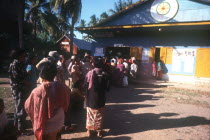 People lining up to vote at a polling station in Anlong.