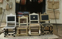 Traditional Ashanti chairs with applied metal decoration.Asante
