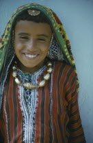 Portrait of child in traditional dress.