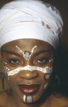 Portrait of woman wearing African make up Named Ibikida Hoga