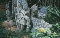 Oshun shrine carvings showing hunters and priests