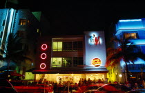 USA, Florida, Miami, South Beach, Ocean Drive, Exterio of Johnny Rocket's diner illuminated at night with neon lights.
