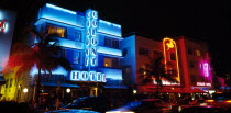 USA, Florida, Miami, Southy Beach, Ocean Drive, Colony Hotel Art Deco bulding illuminated with blue neon lights at night.