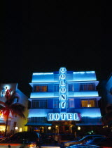 USA, Florida, Miami, South Beach, Ocean, Drive, Colony Hotel Art Deco bulding illuminated with blue neon lights at night.
