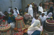 Women selling colourful woven baskets at market.Colorful Gondar