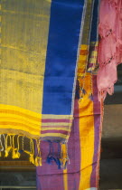 Coloured woven shawls on sale in the souq. Colored