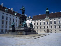Hofburg Royal Palace. In der Burg Courtyard with monument to Emperor Franz I and Leopold Wing to the left behind