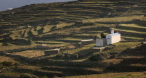 Religious shrine on a terraced hill side.