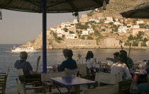 A cafe overlooking the entrance to the port in Hydra Town.