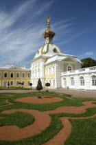 Peterhof Palace also known as Petrodvorets. Monplaisir palace with patterned lawn in the foreground