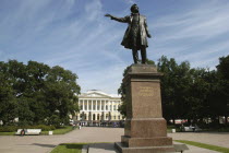 Statue in park with the Mikhailovsky Palace and Russian Museum in the distance