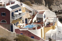 Hillside building with terrace and swimming poolThira Fira Santorini