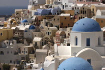 View over the towns architecture with blue domed buildingsThira Fira Santorini