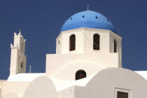 Blue domed building with whitewashed wallsThira Fira Santorini