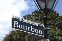French Quarter. Rue Bourbon street sign hanging on a lamp post