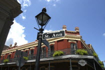 French Quarter. Lamp post and street sign on Rue St Anne with typical architecture behind