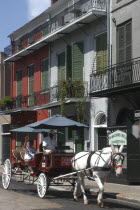 French Quarter. Horse drawn carriage with passenger