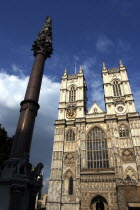 Westminster Abbey west front towers and statue atop column in the foreground