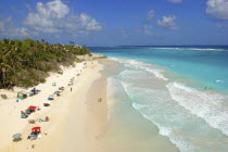 View along Crane beach with scattering of umbrellas and sunbathers