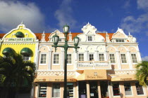 Oranjestad. Colourful colonial style facades of perfumerie and jewellery shops