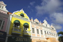 Oranjestad. Colourful colonial style facades of perfumerie and jewellery shops