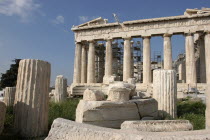 Acropolis. View of the ruined Parthenon with smaller sections of columns in the foreground