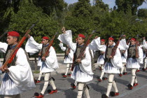 Evzone soldiers in uniform marching in the street