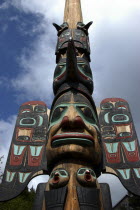 Angled view looking up at a carved wooden Totem pole