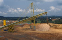 Gold mine with conveyer belt extracting waste material.