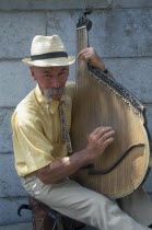 Man playing the bandura.