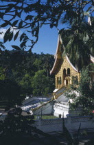 Royal Palace.  Exterior of temple part framed by tree branches.