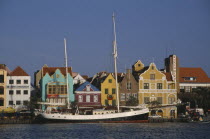 Willemstad.  Waterfront buildings and moored sailing ship.